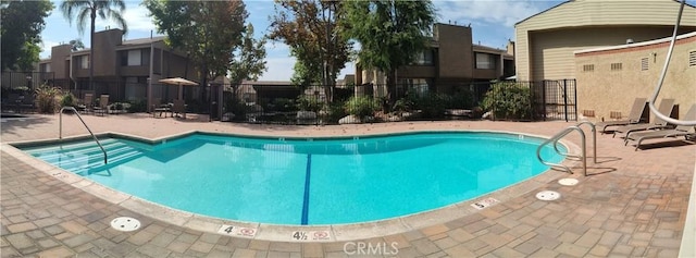 view of swimming pool featuring a patio area