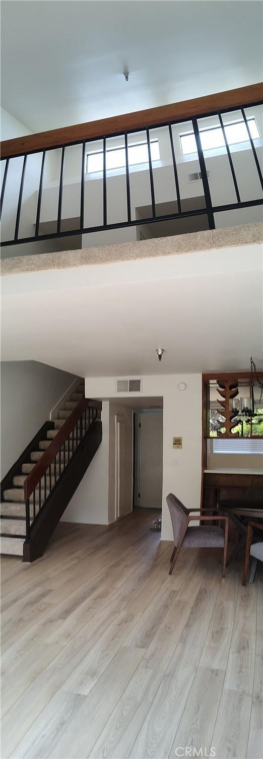 staircase with wood-type flooring