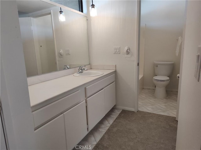 bathroom with toilet, tile patterned floors, and vanity