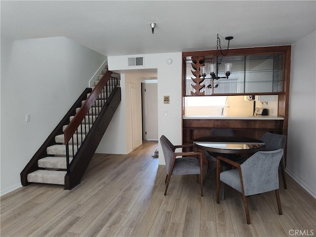 dining room with light wood-type flooring