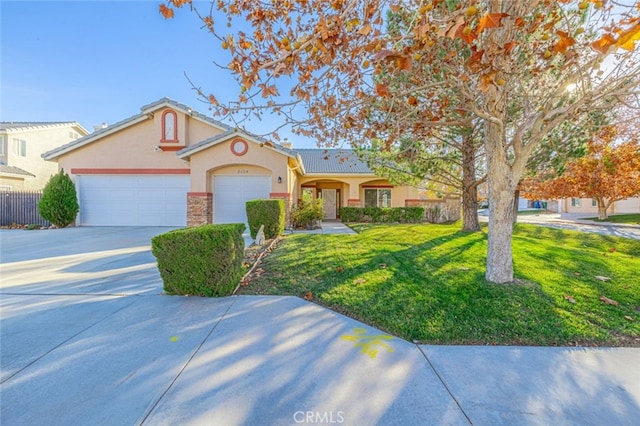 ranch-style home with a front lawn and a garage