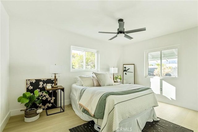 bedroom featuring light wood-type flooring and ceiling fan