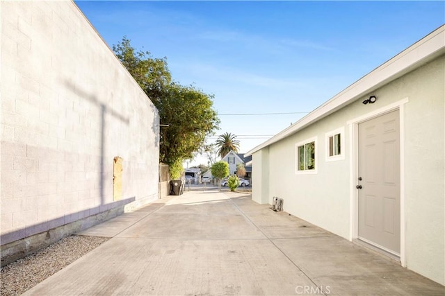 view of side of home with a patio