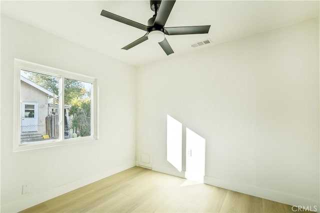 spare room featuring ceiling fan and light wood-type flooring