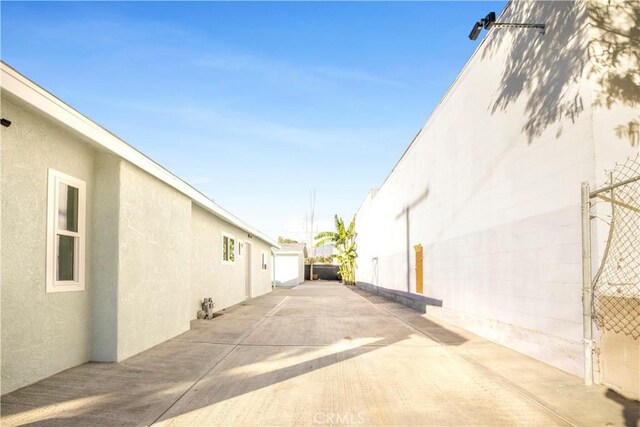 view of side of property featuring a patio area