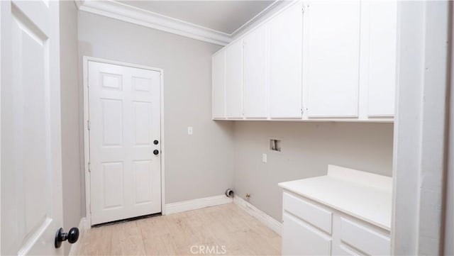 laundry room featuring cabinets, crown molding, light hardwood / wood-style floors, and hookup for a washing machine