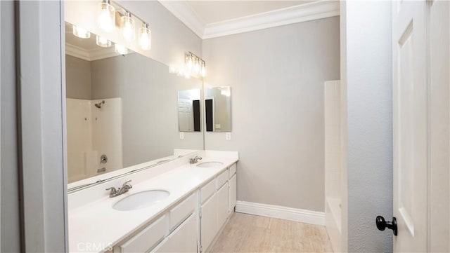 bathroom featuring shower / bathing tub combination, vanity, and crown molding