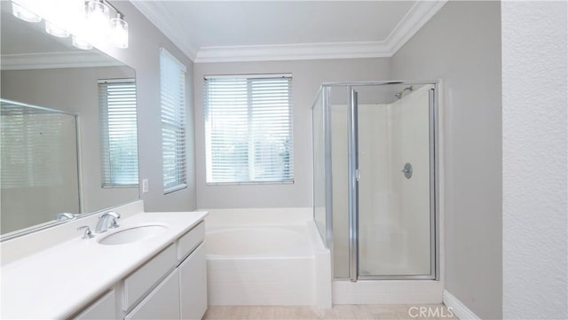 bathroom featuring vanity, crown molding, and shower with separate bathtub