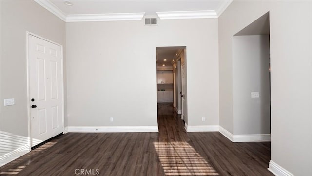 unfurnished room featuring dark hardwood / wood-style floors and ornamental molding