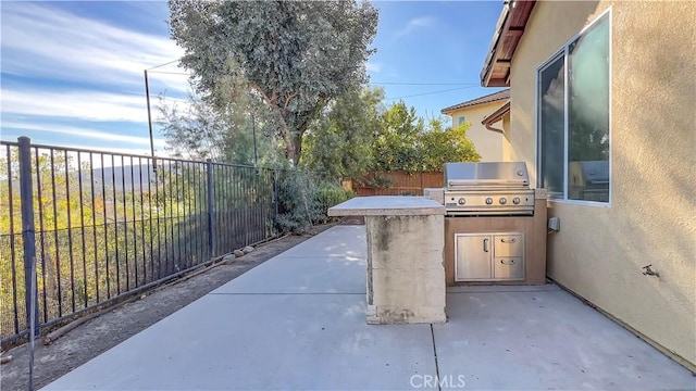 view of patio / terrace with an outdoor kitchen and area for grilling