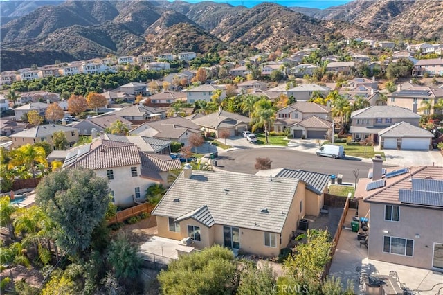 birds eye view of property featuring a mountain view