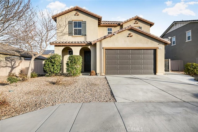 mediterranean / spanish-style home with a garage