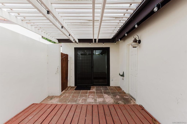 entrance to property featuring a pergola