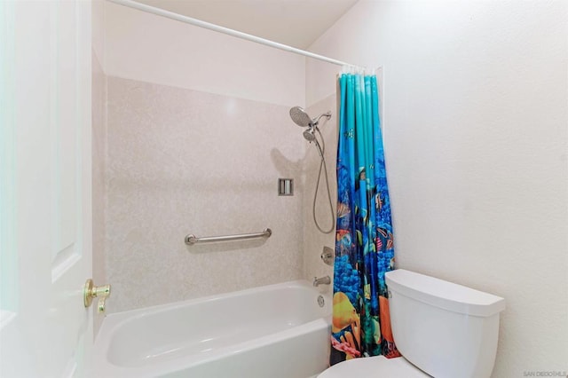 bathroom featuring toilet and shower / bath combo with shower curtain