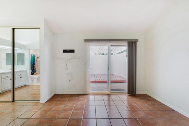 spare room with light tile patterned floors