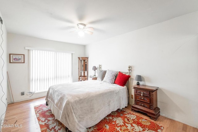 bedroom featuring ceiling fan and light hardwood / wood-style flooring