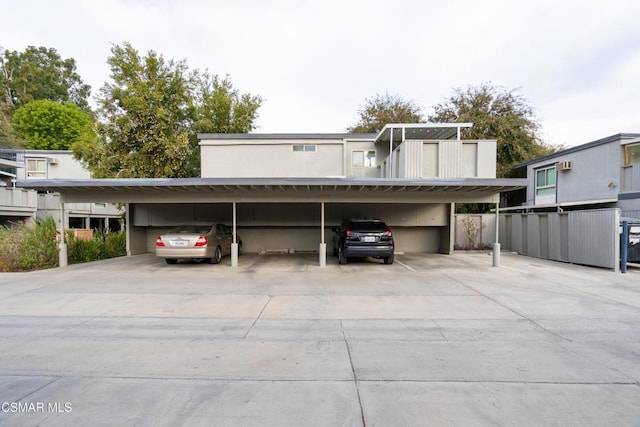 view of vehicle parking with a carport