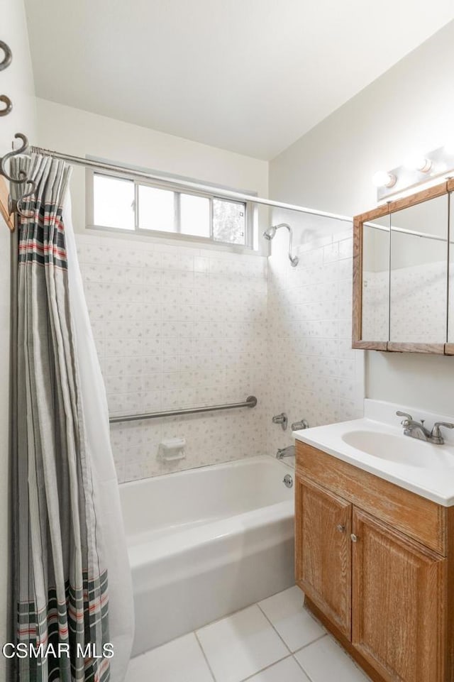 bathroom featuring tile patterned floors, shower / bath combo, and vanity