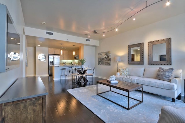 living room with dark wood-type flooring