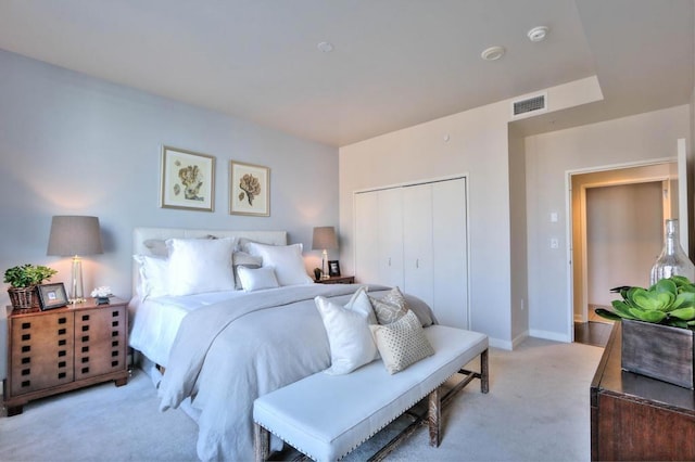 carpeted bedroom with a closet