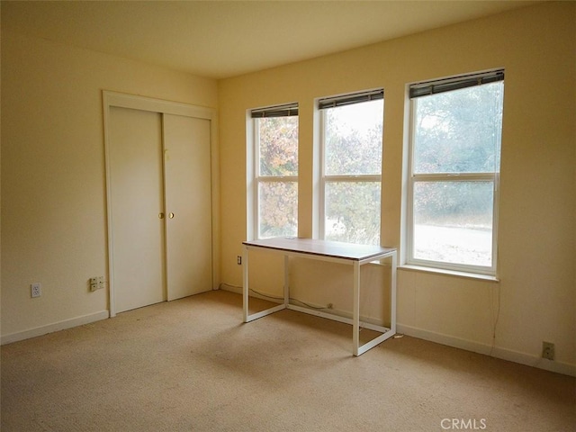 unfurnished bedroom with light carpet