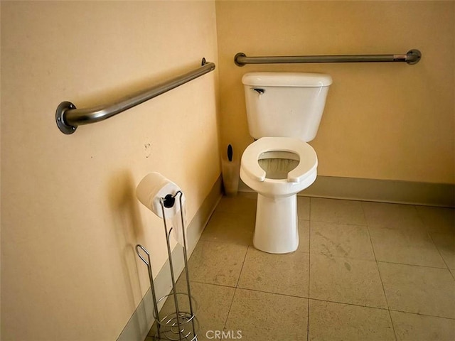 bathroom featuring tile patterned floors and toilet