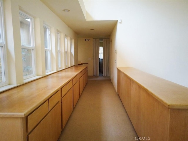 bar with light brown cabinets