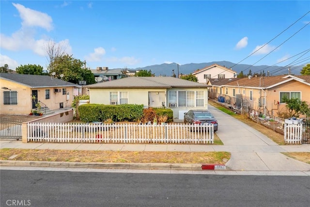 single story home featuring a mountain view