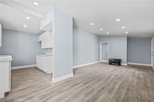 unfurnished living room with light hardwood / wood-style flooring