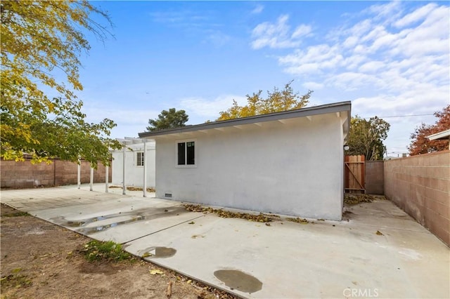 back of house featuring a patio area