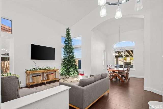 living room with high vaulted ceiling