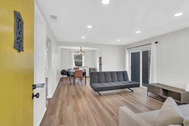 living room with light hardwood / wood-style floors