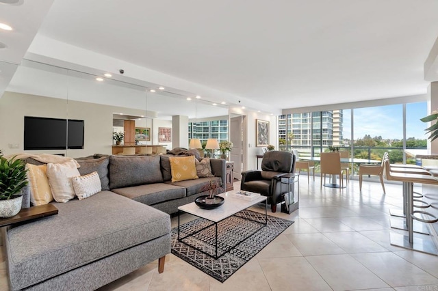 living room with light tile patterned flooring, recessed lighting, and floor to ceiling windows