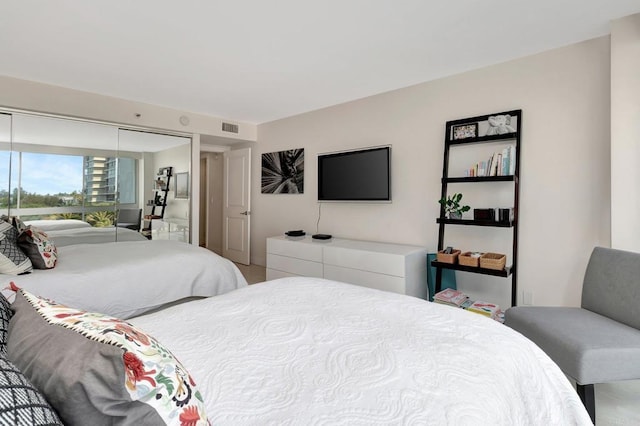 bedroom with visible vents and a closet