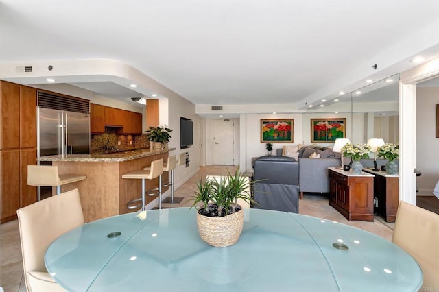 dining room with light tile patterned floors, visible vents, and recessed lighting