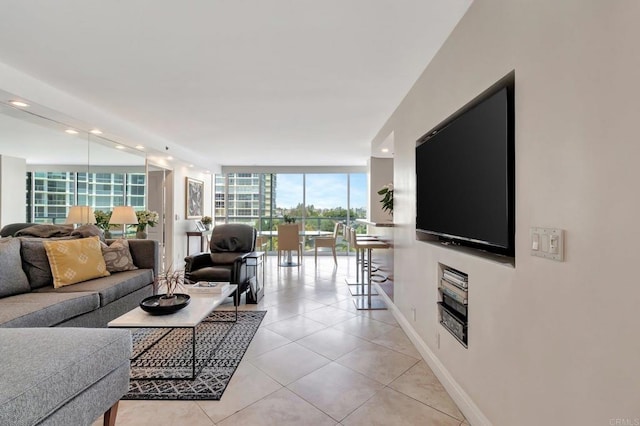 living room featuring expansive windows, recessed lighting, baseboards, and light tile patterned floors