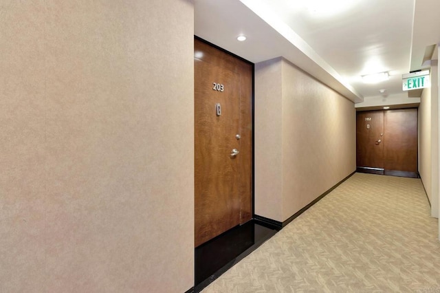 hallway featuring baseboards