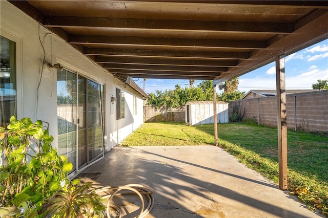 view of patio / terrace with a storage unit