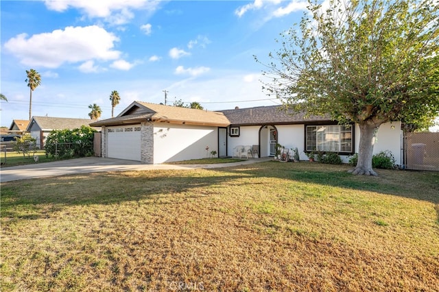 single story home featuring a front lawn and a garage