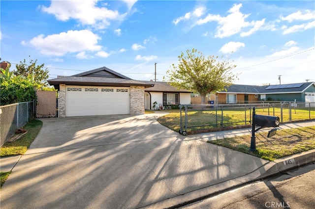 ranch-style home featuring a garage and a front yard