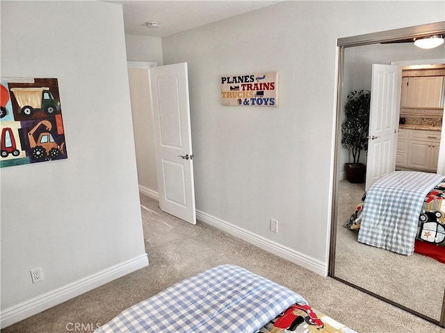 bedroom featuring light colored carpet