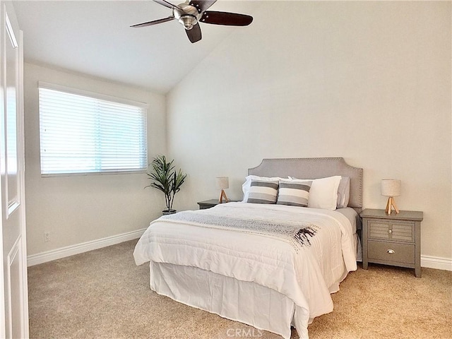 carpeted bedroom featuring ceiling fan and lofted ceiling