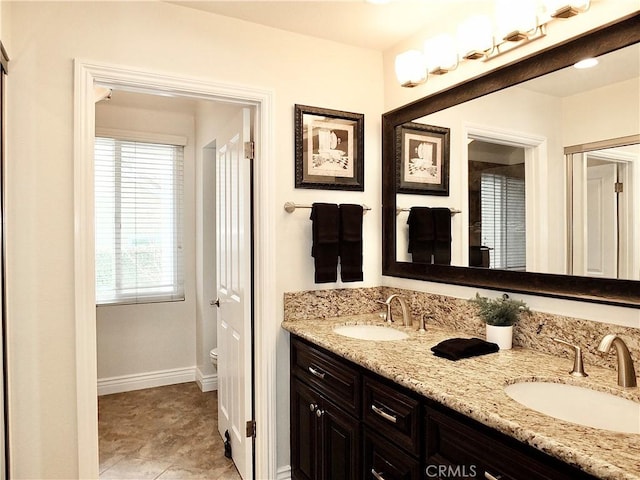 bathroom with tile patterned floors, toilet, and vanity