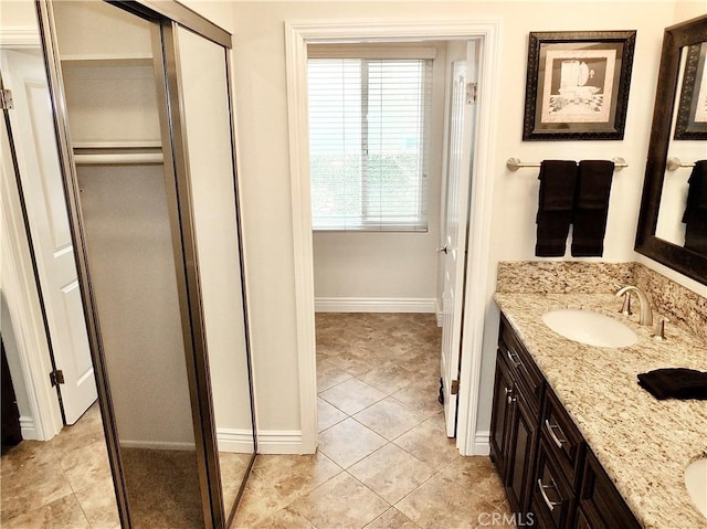 bathroom featuring tile patterned flooring and vanity