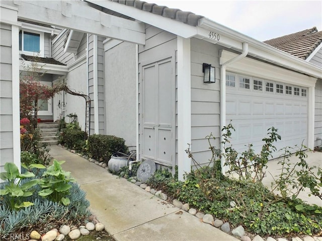 view of side of property featuring a garage