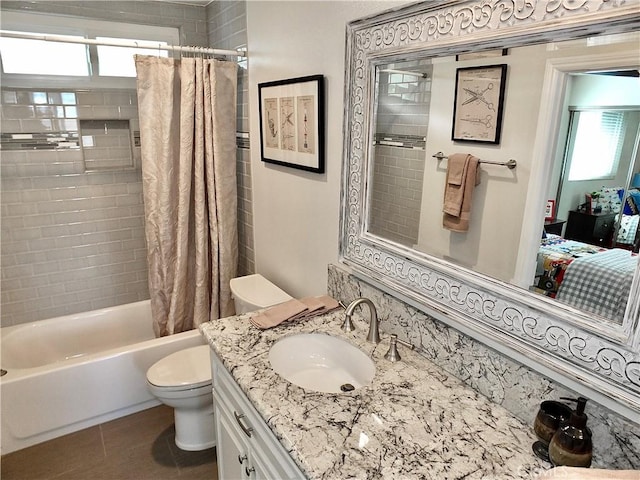 full bathroom with toilet, plenty of natural light, tile patterned floors, and shower / bath combination with curtain