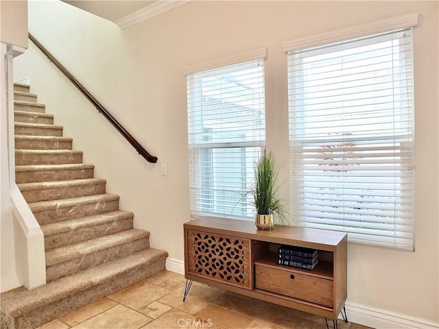 interior space with plenty of natural light and crown molding