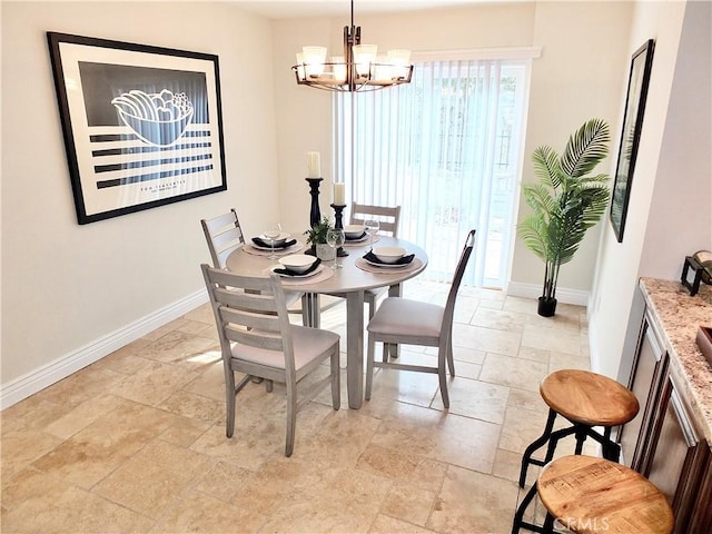 dining area featuring an inviting chandelier