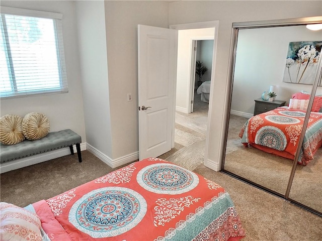 carpeted bedroom with a closet