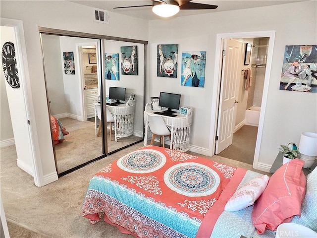 carpeted bedroom featuring ceiling fan, a closet, and connected bathroom